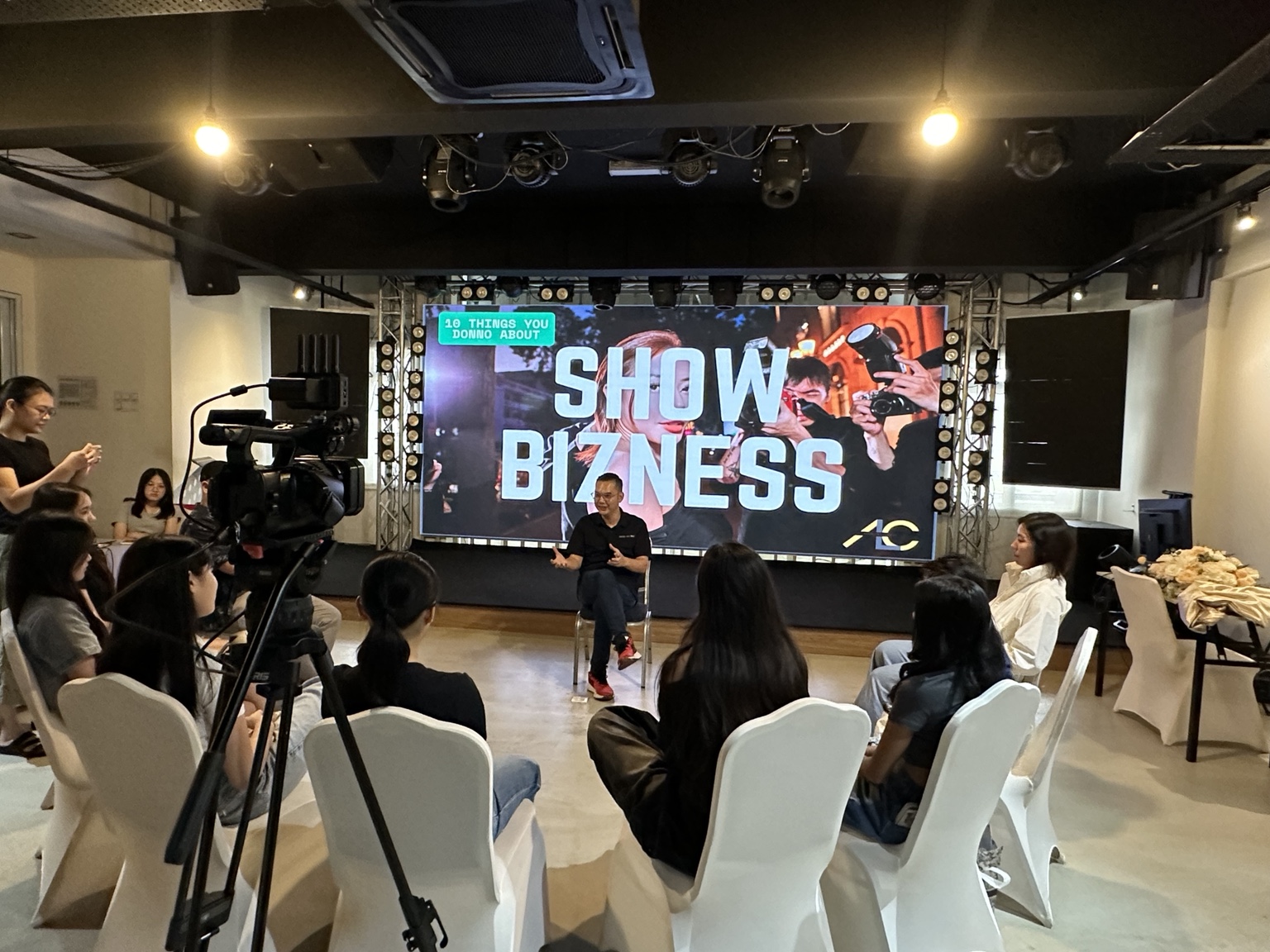 U-shape seating arrangement facing the LED screen during a talk at Dreamlive Event Space