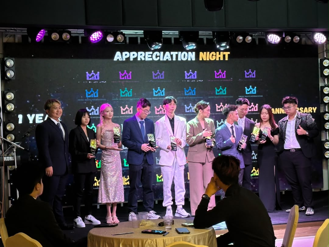 Company appreciation night with guests at dinner tables facing the stage at Dreamlive Event Space Puchong