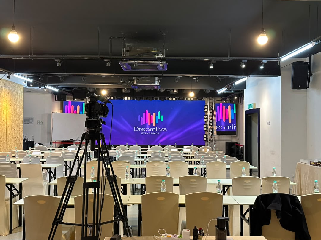 Dreamlive Event Space Puchong set up theatre-style with branding on the LED screen