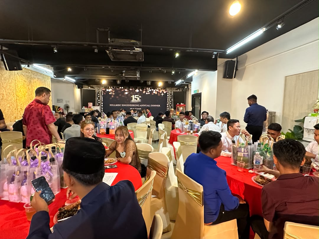 Company annual dinner with round tables and 15th anniversary backdrop at Dreamlive Event Space Puchong